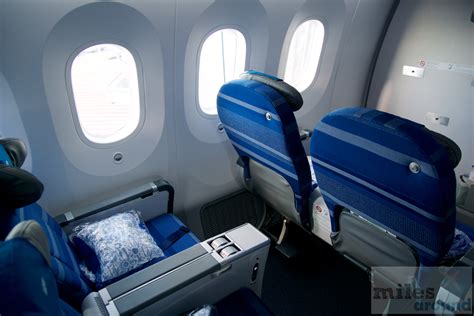 Metal boxes under the seat on 787 economy 